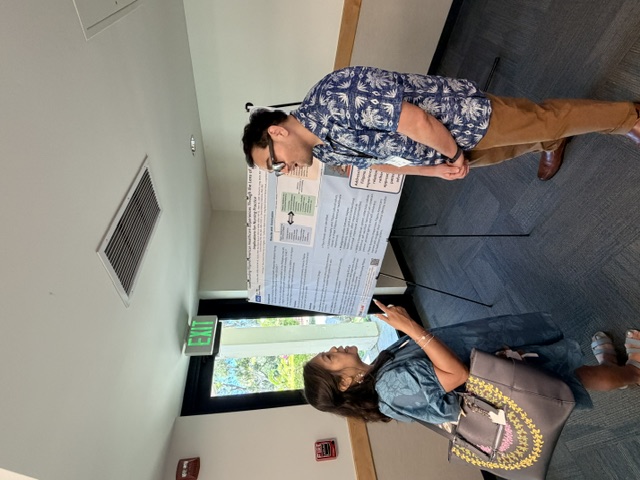 Paolo Roca with the poster at AAPINA