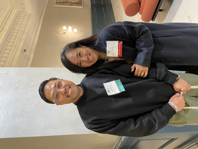 Connecting with colleagues at the meeting.