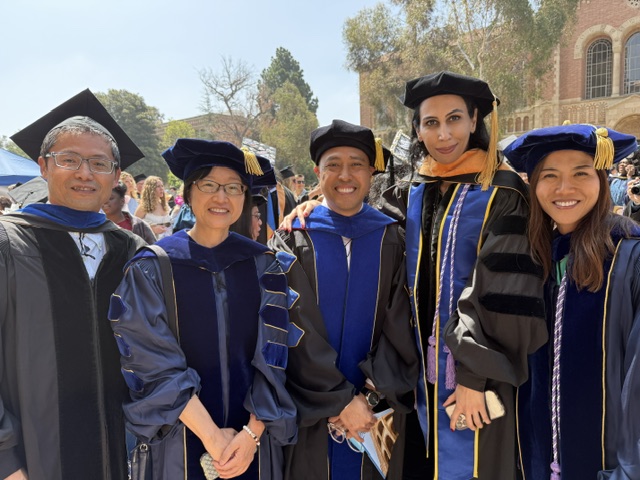 Celebrating with graduates and colleagues.